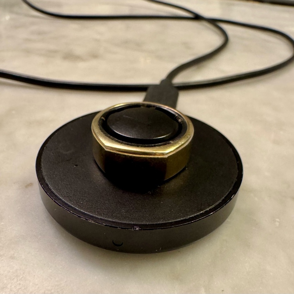 Oura Ring in heritage gold size 7, charger included